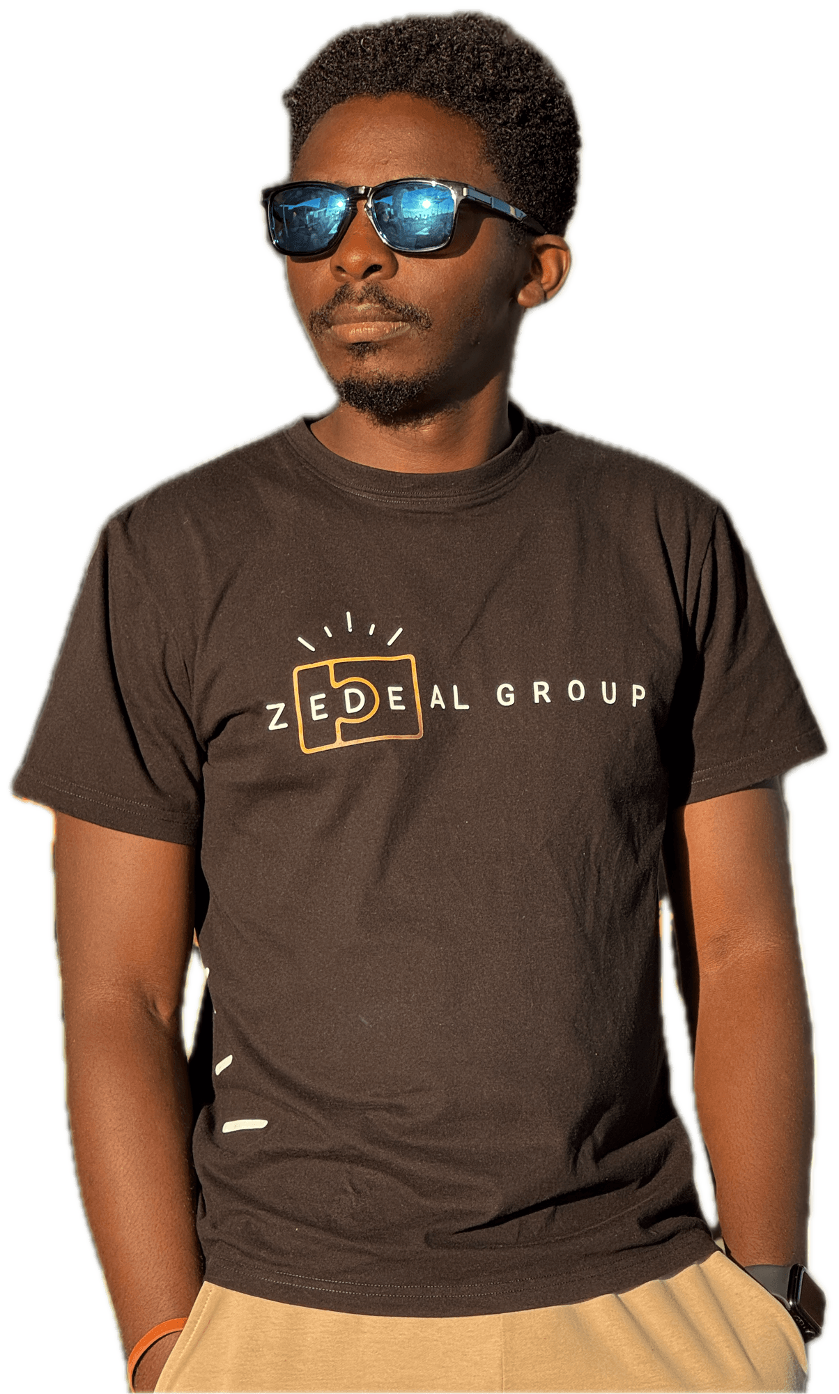 Portrait of Dan Baruka standing, hands in pockets